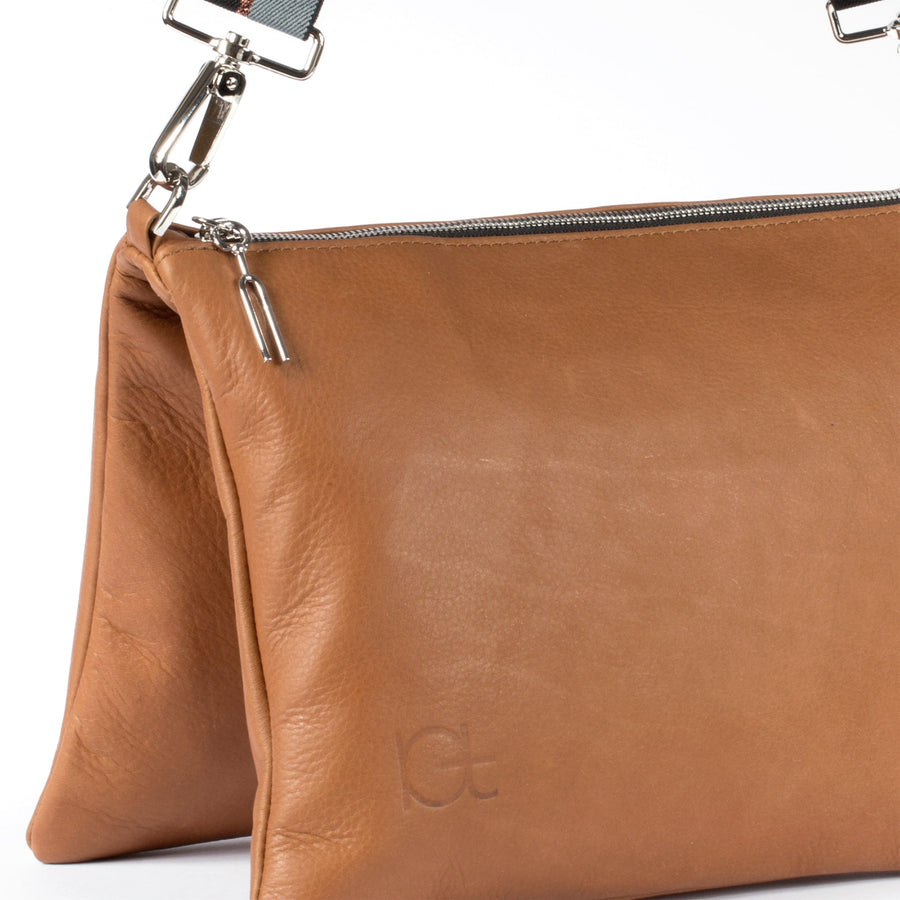 detail leather bag Sella color cognac  handmade with an elastic shoulder strap 