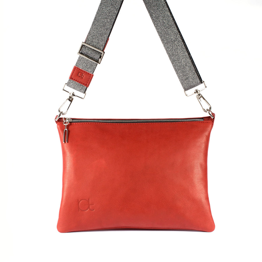 Leather Bag Sella color rubino  handmade with an elastic shoulder strap 