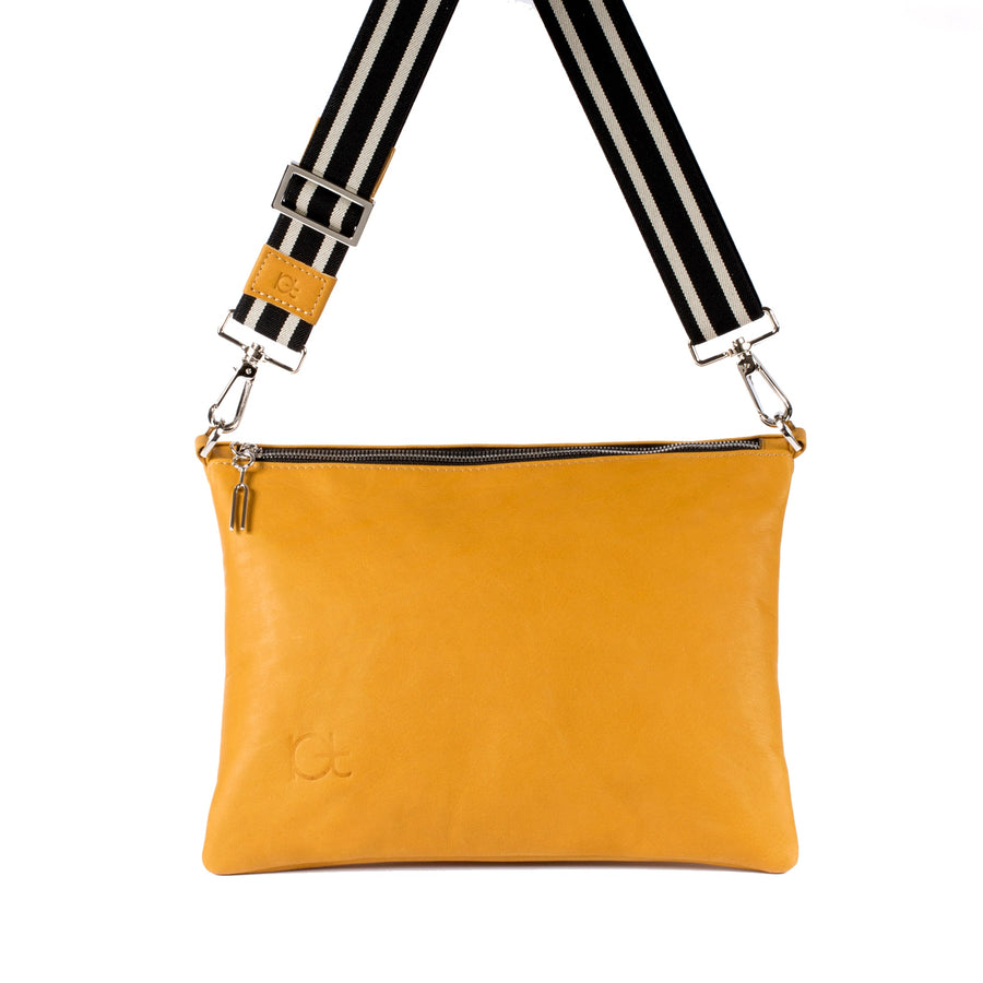 Leather Bag Sella color topazio handmade with an elastic shoulder strap 